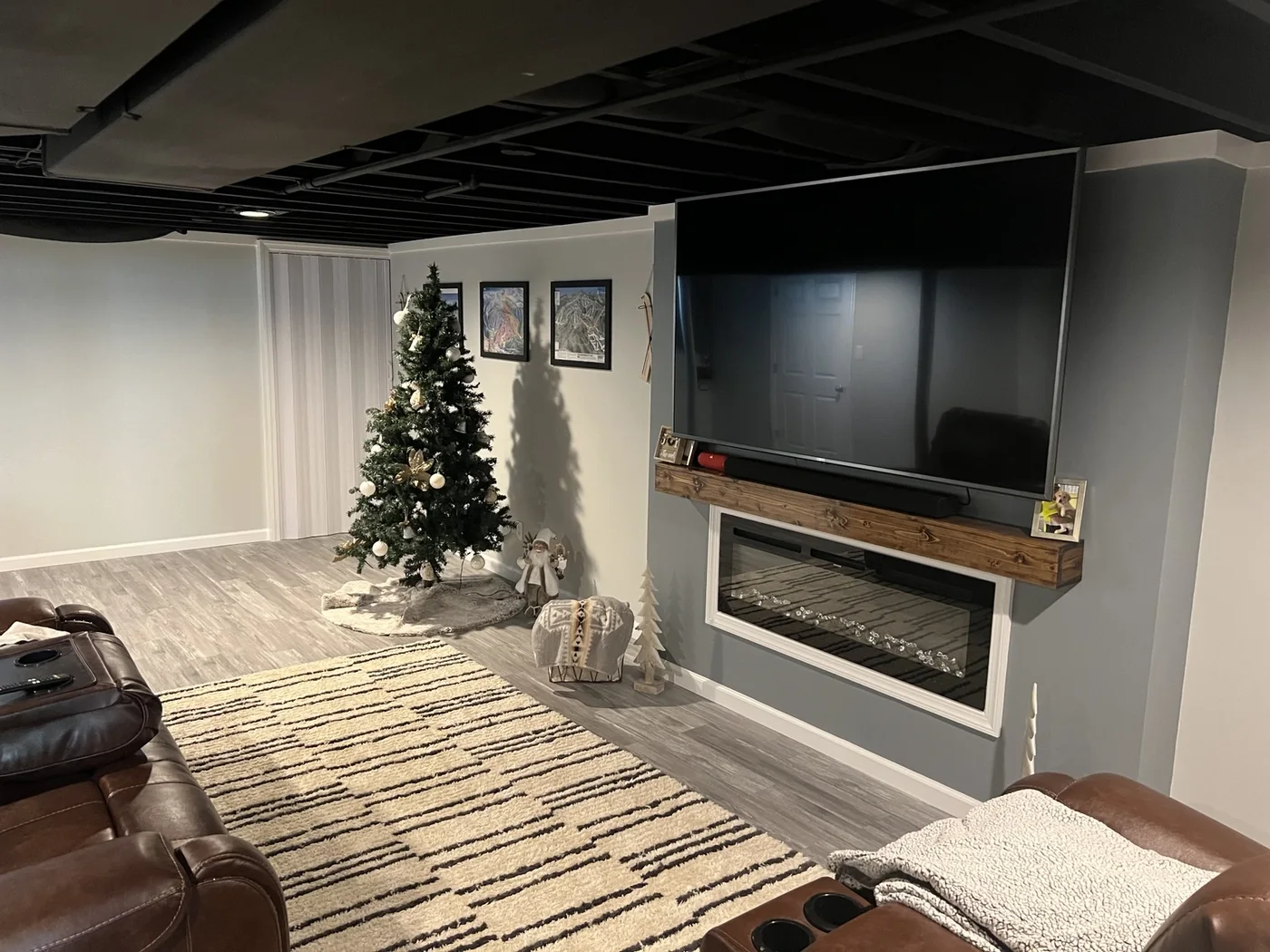 Finished basement media room with fireplace
