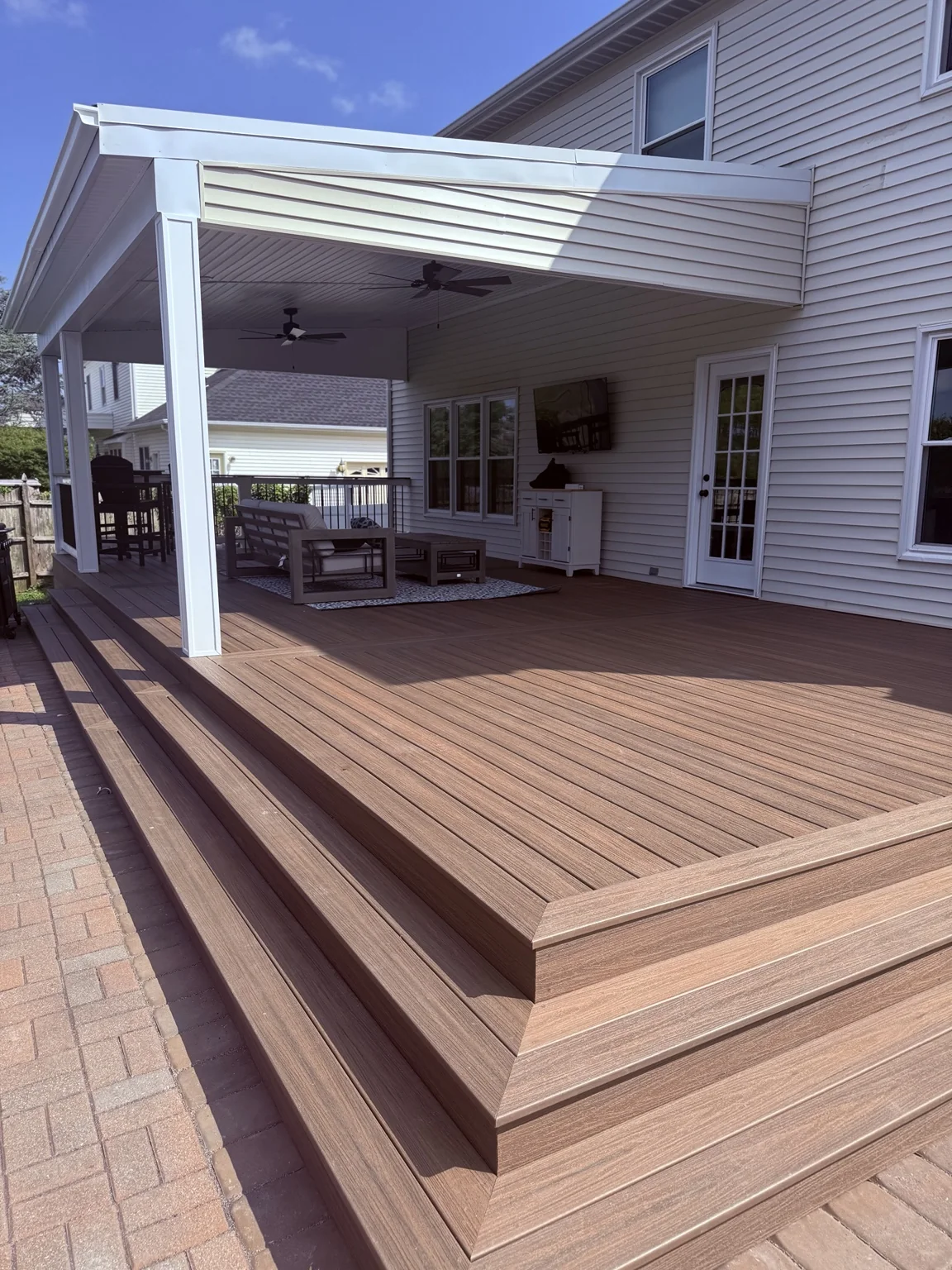 Covered composite deck with fans and seating