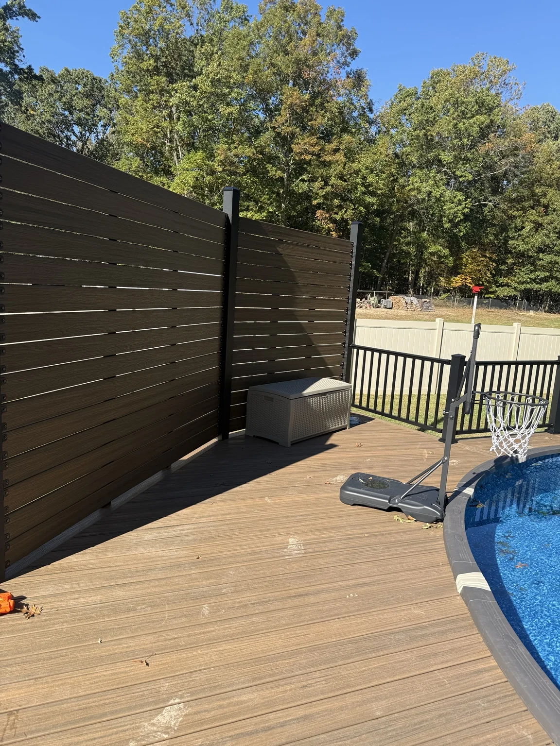 Composite pool deck with black aluminum railing